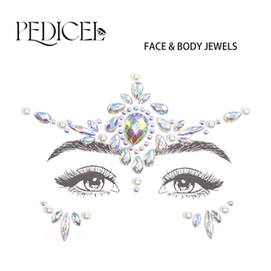 Close-up of iridescent face and body jewel set with teardrop gems and white pearls