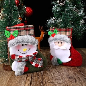 Christmas stocking gift bags with Santa and snowman patterns for holiday decorations