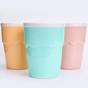 Three creative slushy cups in yellow, mint green, and pink with wave-textured silicone bodies