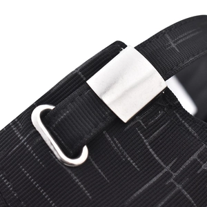 Macro view of black woven strap with silver rectangular metal buckle and oval ring detail
