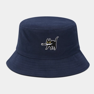 Detail of navy blue canvas bucket hat featuring a funny black cat embroidery on the front