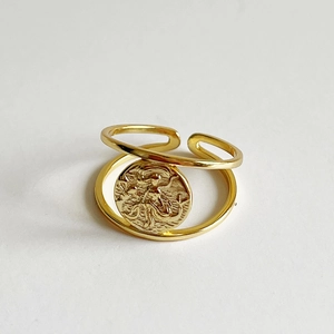 Minimalist double layer adjustable golden ring with vintage coin relief charm on white background