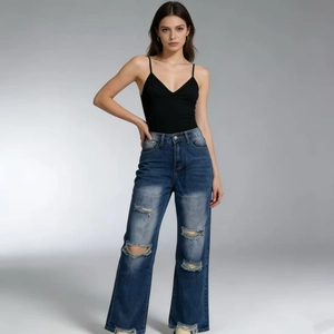 Detailed view of blue washed straight-leg jeans with fringe distressed ripped detailing