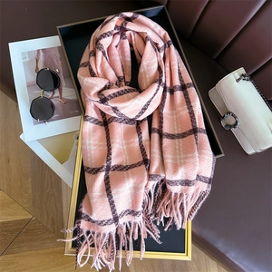 Pink checkered cashmere-feel scarf detail with tassels and stylish lifestyle props
