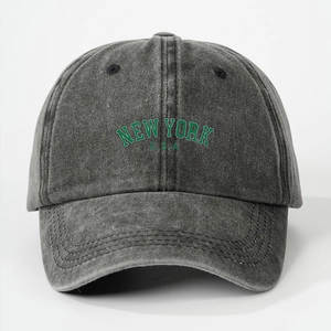 Detail view of New York USA embroidery on dark grey washed denim baseball cap