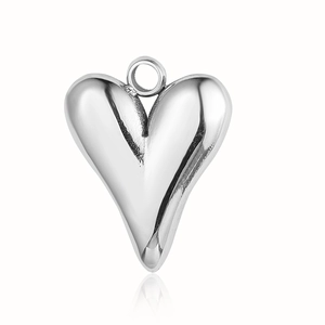 Polished silver heart pendant with devil eye shell detail and metal hanging ring