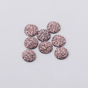 Macro shot of 12mm rose gold resin flatback drusy stones for jewelry making