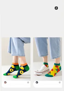 Detailed view of trendy fruit pattern ankle socks worn by model for summer style