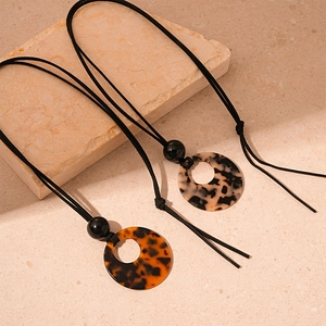 Vintage acrylic leopard print geometric circle pendant necklace for women on marble base