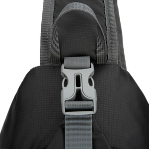 Close-up of durable gray plastic buckle and nylon fabric on the outdoor waist bag