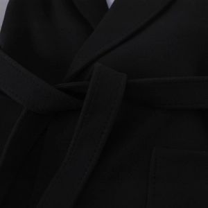 Women's black woolen jacket featuring a waist tie design and textured woven fabric detail
