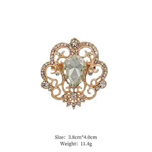 Macro shot of vintage hollow gold alloy brooch with crystal and rhinestone details