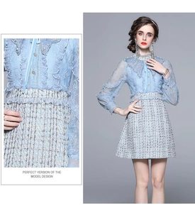 Detail of light blue tweed dress featuring lace sleeves and elegant pearl button accents