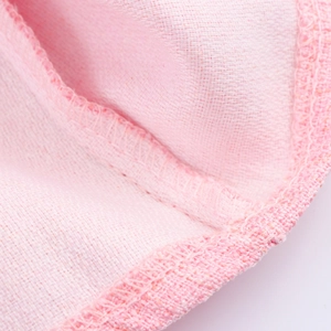 Pink French style woven tank dress featuring detailed texture and reinforced hem stitching