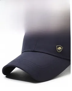 Close-up of navy twill cotton baseball cap with golden FASHION metal shield emblem