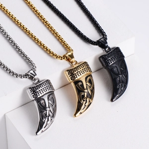 Detailed view of Celtic knot necklaces in silver, gold, and black finishes on jewelry props