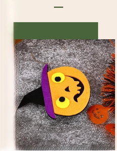 Detail of felt Halloween pumpkin with purple wizard hat on a mesh headband for kids