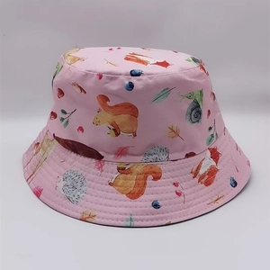 Detailed close-up of pink bucket hat with fox and squirrel animal pattern prints