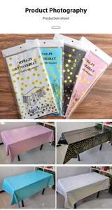 Detail of disposable plastic tablecloths with gold foil dots in multiple colors