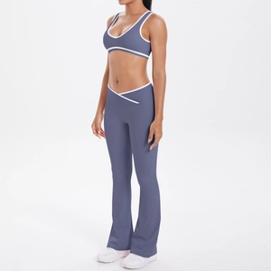 Detail view of smog blue yoga set with V-shaped high waist flared pants and contrast piping