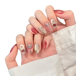 Pink cat eye press-on nails with luxury pearls, rhinestones and vintage palace style accents