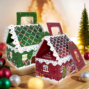 Detail of red and green gingerbread house gift boxes with tags in a festive Christmas setting