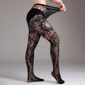 Detail of high-elastic black lace tights showing intricate mesh patterns and stretch fit