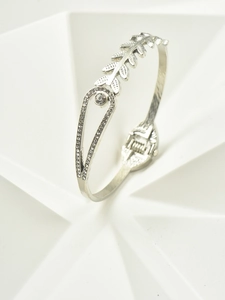Detail of silver leaf bracelet with sparkling crystals and spring closure mechanism