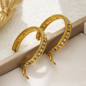 Polished gold round hoop earrings with sparkling white cubic zirconia pavé stones