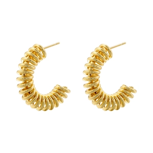 Detail of French vintage gold plated C-shaped hoop earrings with spiral twisted texture