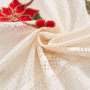 White Christmas lace curtain fabric with red floral embroidery and geometric cutouts