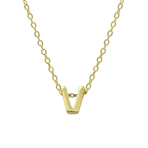 Macro shot of gold V-shaped letter pendant on a delicate sterling silver link chain