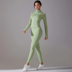Detail of mint green yoga set with slim fit zipper jacket and thumbhole sleeves