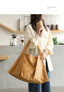 Detailed texture of khaki DuPont paper shoulder bag with natural wrinkled finish