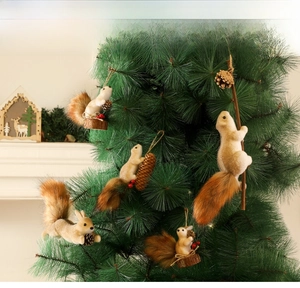 Realistic squirrel Christmas ornament with pine cone and red berry on festive tree