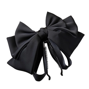Elegant large black satin bow banana clip hair accessory for women on white background