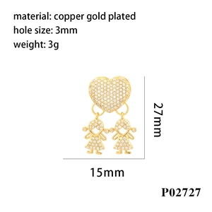 Macro view of 18K gold plated heart pendant with full diamond-encrusted boy and girl charms