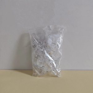 Detailed package view of clear acrylic snowflake ornaments with silver metal rings
