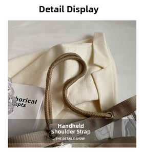 Detail of PVC shoulder bag with brown woven rope handle and silver metal eyelets
