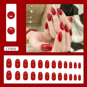 Glossy vibrant red oval press-on nails set with 24 pieces of varying sizes