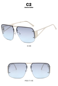 Macro detail of gray-blue gradient rimless sunglasses with hollowed-out metal frames
