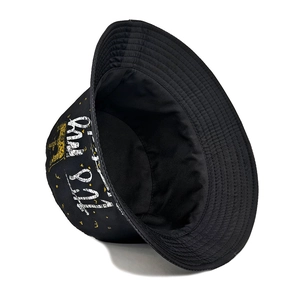 Black bucket hat with yellow crown print and distressed white lettering in street style