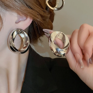 Polished silver twisted oval earrings for women featuring a minimalist geometric design