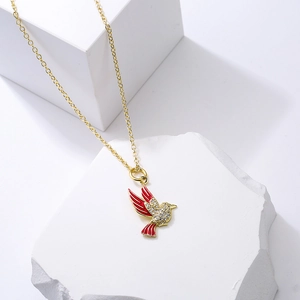 Gold plated love bird pendant necklace with sparkling zircons on white stone setup