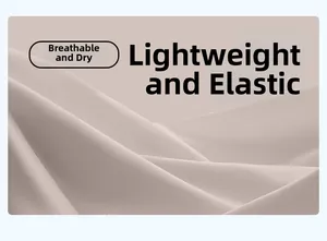 Macro shot of breathable high-stretch yoga fabric with subtle twill texture in beige grey