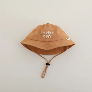 Close-up of sunny day smile embroidery and windproof cord on kids cotton bucket hat