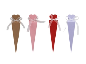 Detail of cone-shaped candy boxes with heart-shaped tops and white translucent ribbons