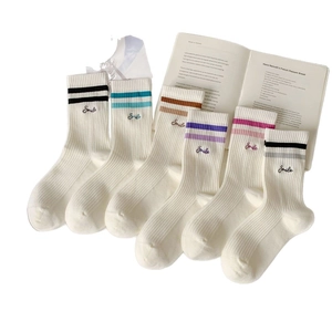 Mid-calf athletic socks with Smile embroidery and double stripe design in six colors