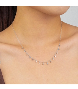 Detail of 925 silver fringe necklace with colorful zircons on a model neck