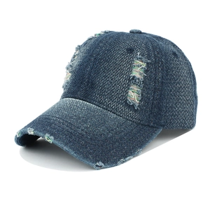 Distressed dark blue denim baseball cap with rainbow frayed details and vintage washed finish